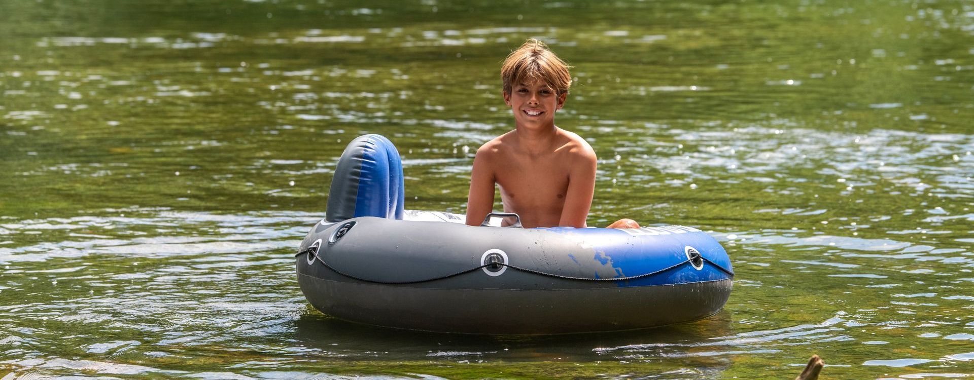 Child floating in river