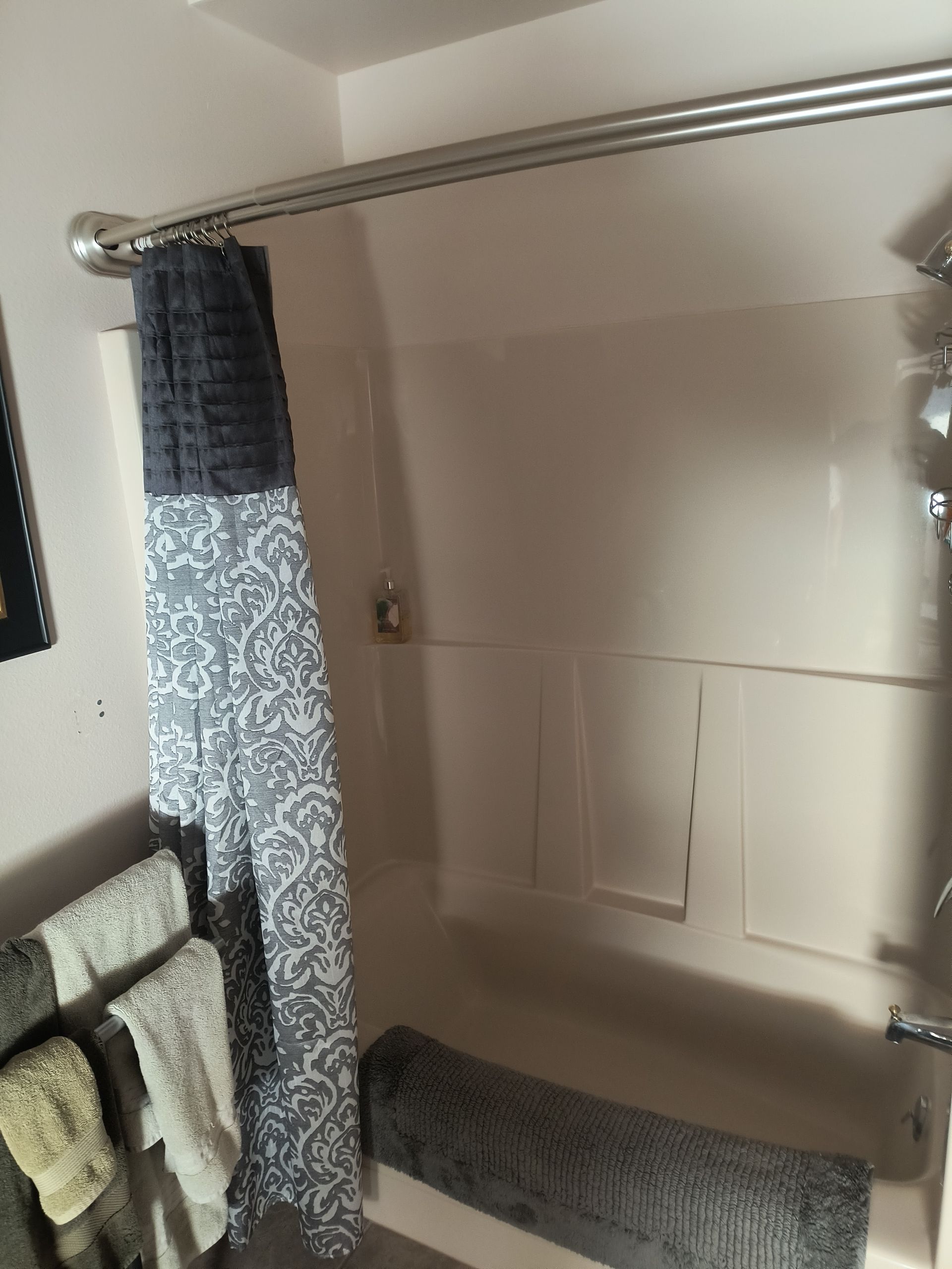 Before fiberglass tub and shower in a bathroom remodel in Bellingham, WA by Alderwood Builders LLC.