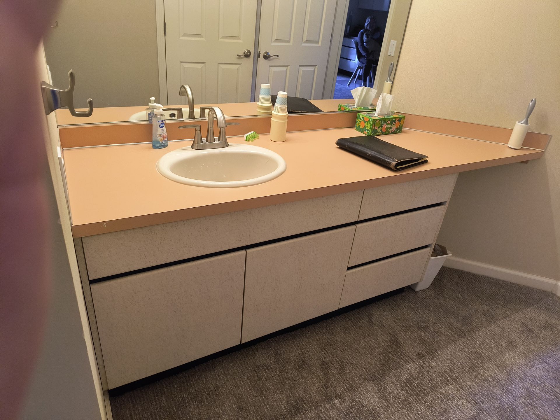 Before bathroom remodel with a single vanity in Bellingham, WA by Alderwood Builders LLC.
