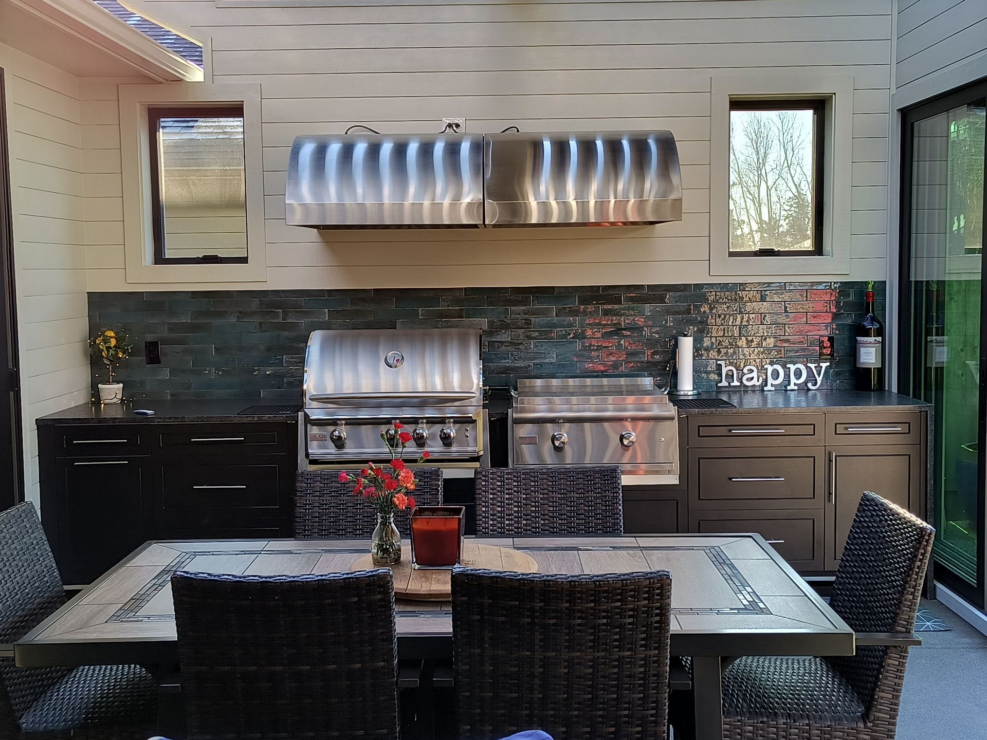 Covered outdoor living space with pergola and lounge seating in Bellingham, WA.