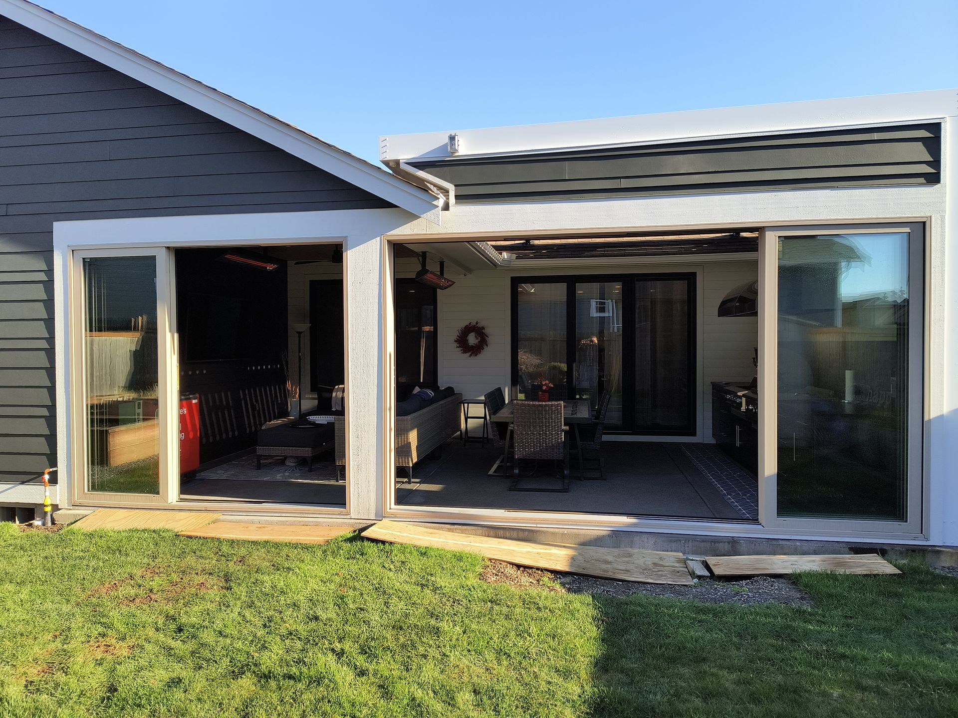 Custom covered outdoor living space with outdoor kitchen in Bellingham, WA.