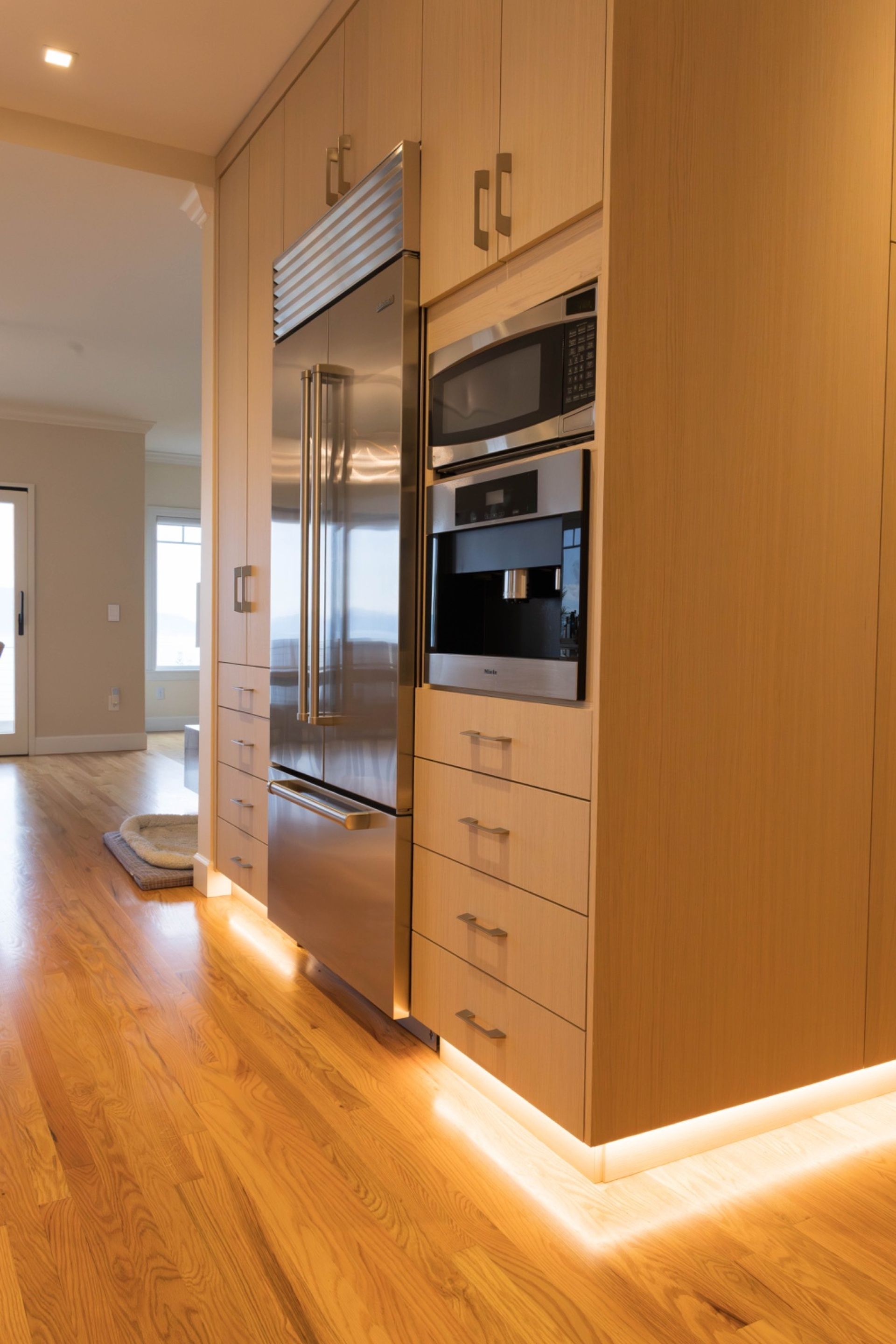 Kitchen remodel in Bellingham, WA with custom wood cabinetry, center island, and modern finishes.