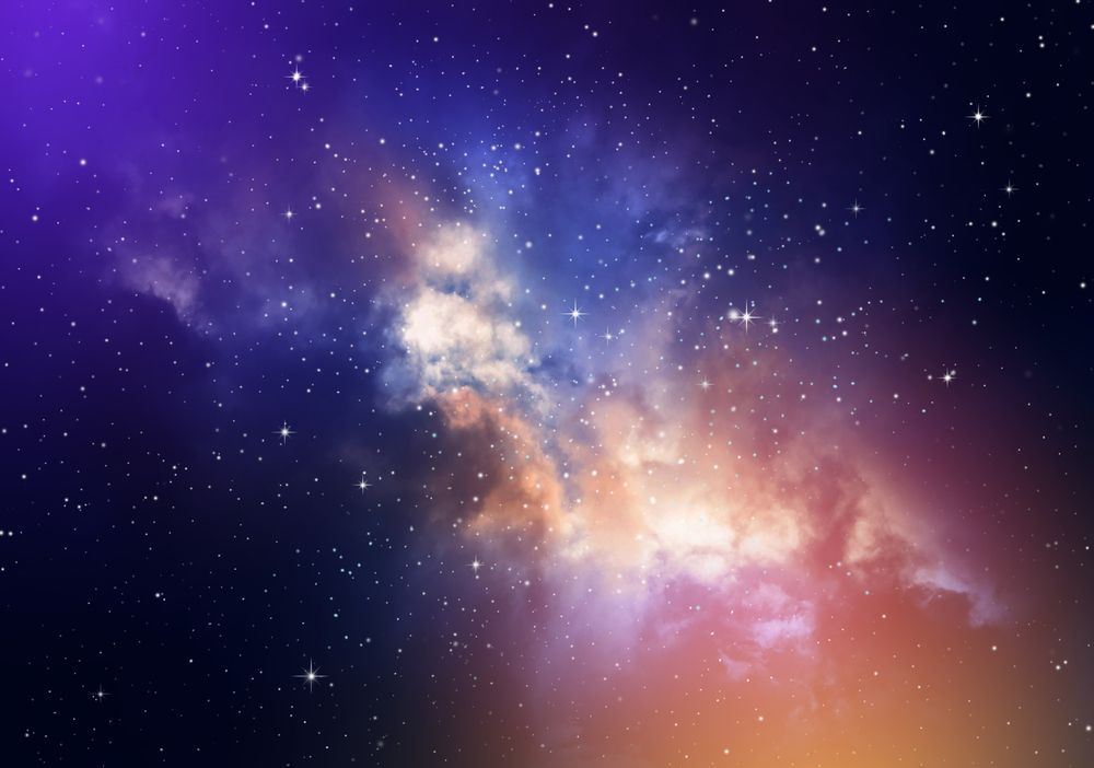 A colorful galaxy with lots of stars in the night sky