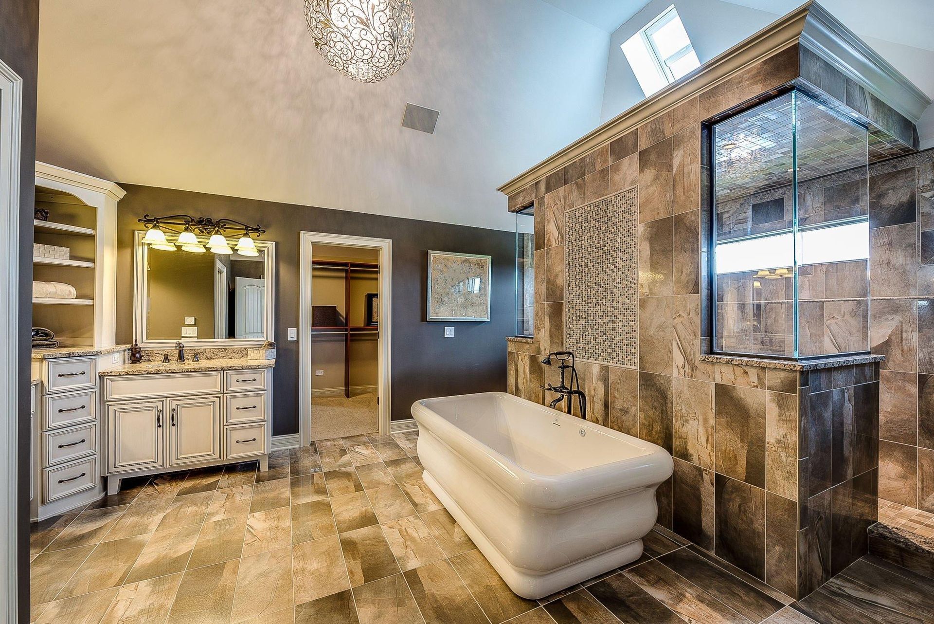 A bathroom with a bathtub and a walk in shower.