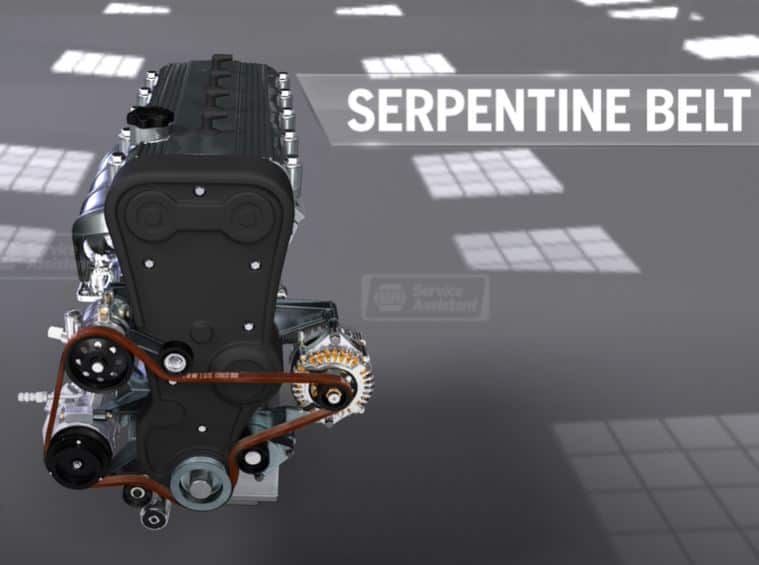 Serpentine belt on an engine. Brown belt wraps around pulleys and connects engine components.