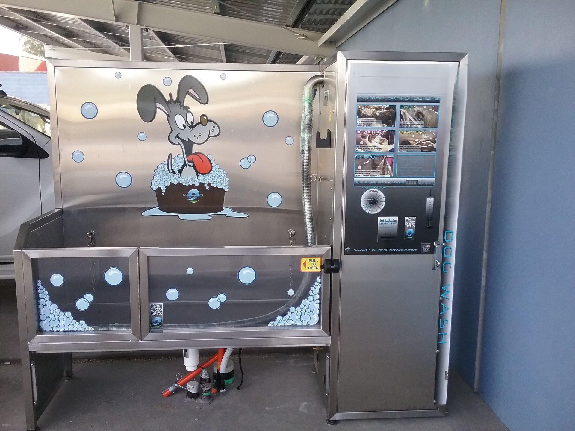 Snoopy-themed arcade game booth with two metal bins and a slot machine-style cabinet.