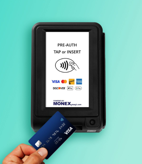 Contactless payment terminal with card being tapped, showing “PRE-AUTH TAP OR INSERT” screen.