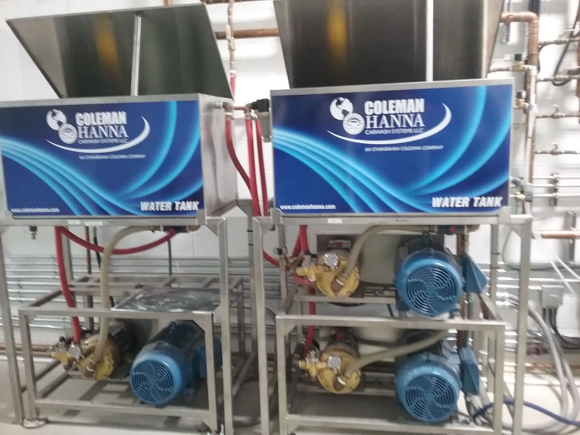 Two coleman hanna water tanks are sitting next to each other
