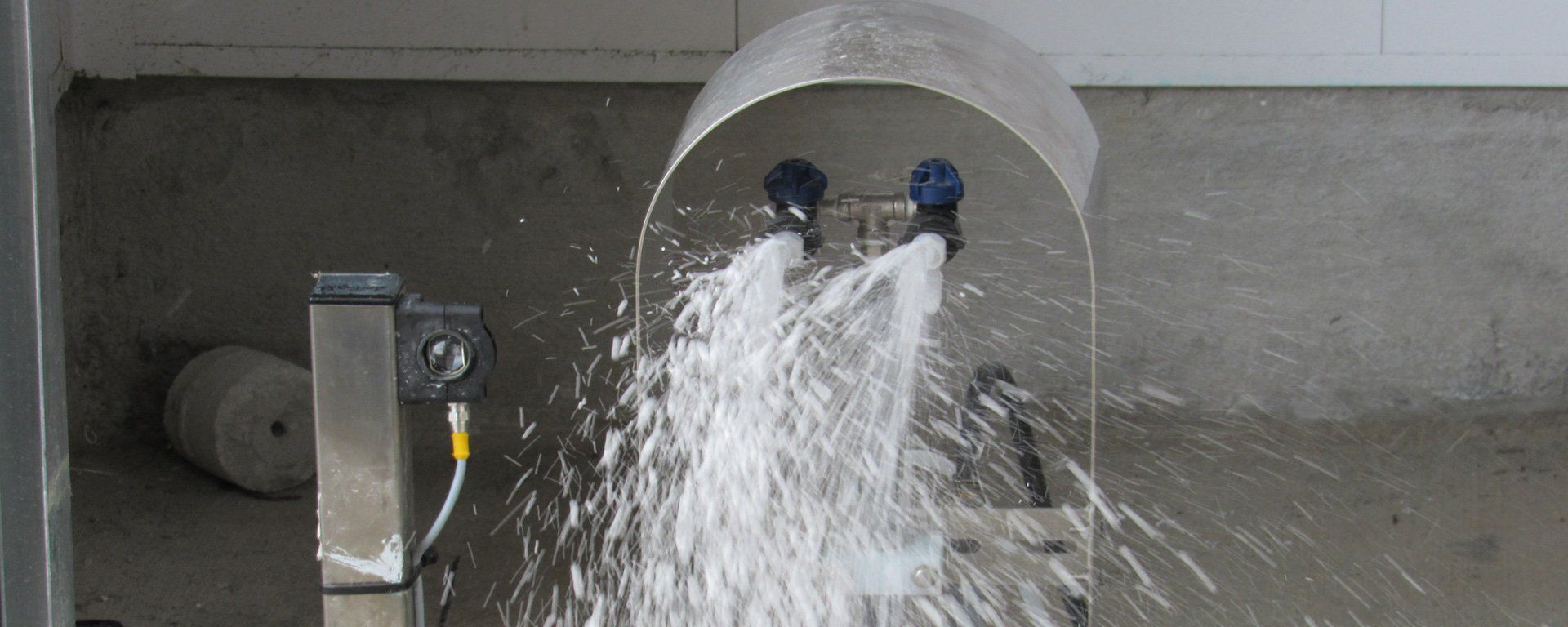 A close up of a water fountain with water spraying out of it.