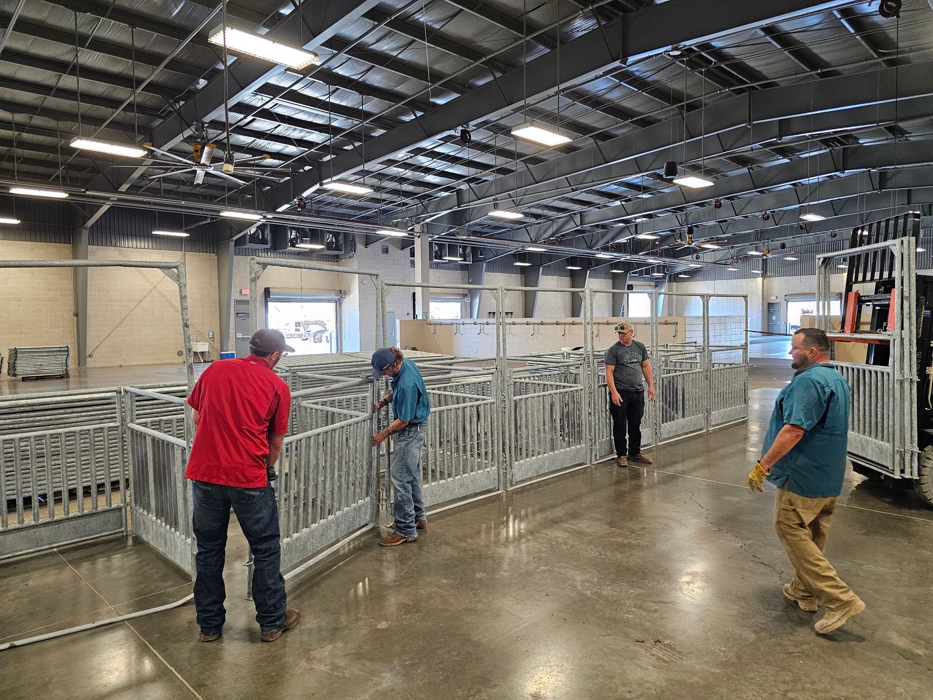 A group of men are working in a large warehouse.