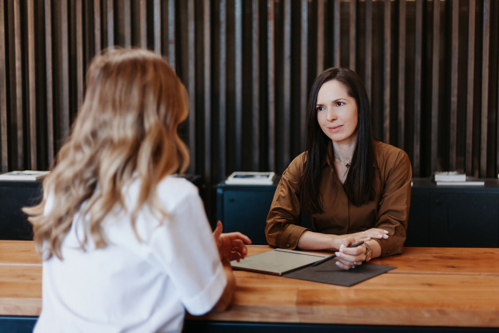Polina Kozlova, trusts and estates lawyer, meeting a client at PK Law in Auckland
