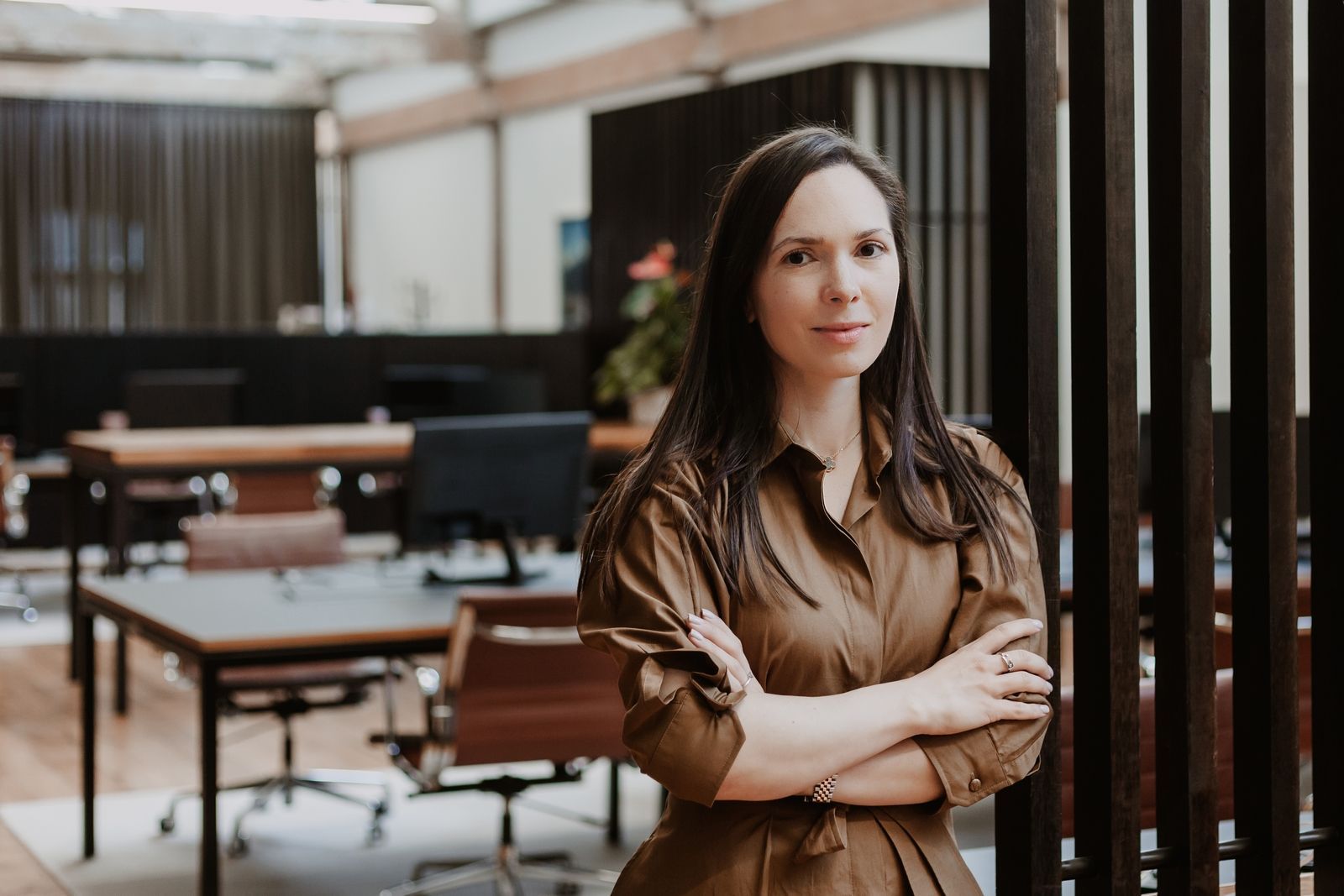 Polina Kozlova of PK Law standing in the Auckland office
