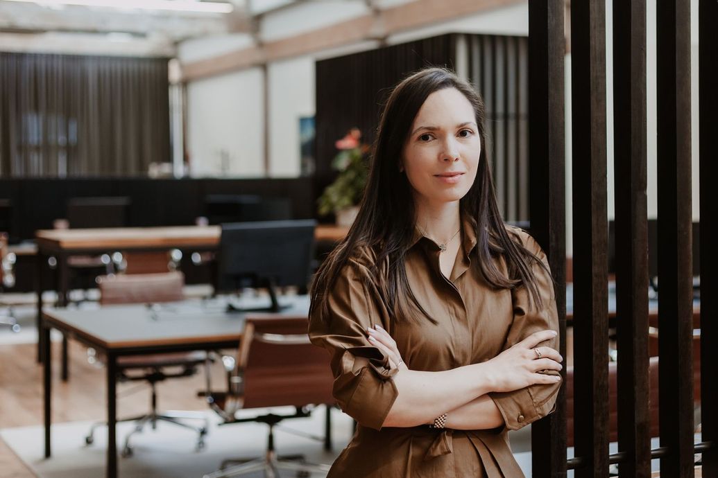 Polina Kozlova of PK Law standing in the Auckland office
