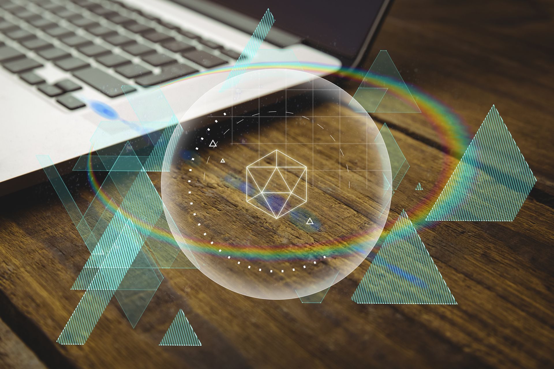 Laptop with geometric shapes and a holographic projection on a wood surface.