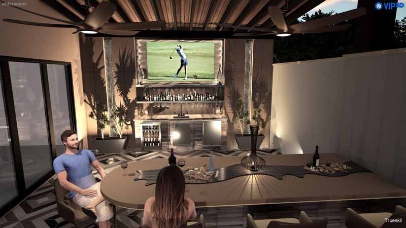 People seated around a dining table watching a golf game on a large wall screen in a dim room