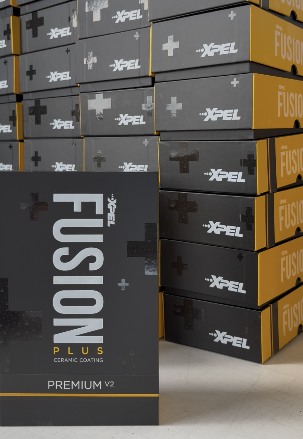Boxes of XPEL FUSION PLUS premium automotive coating.