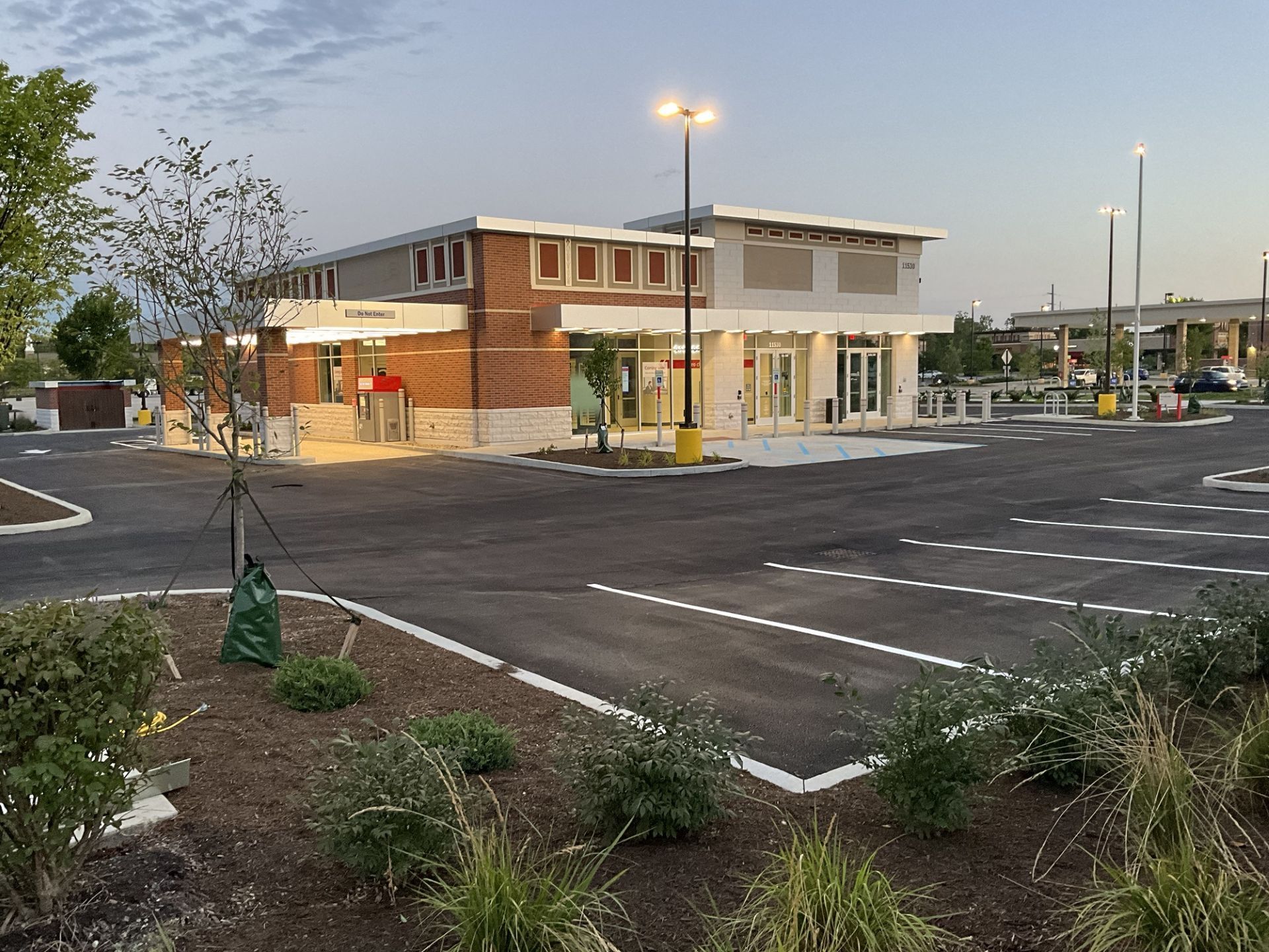 A large building with a parking lot in front of it