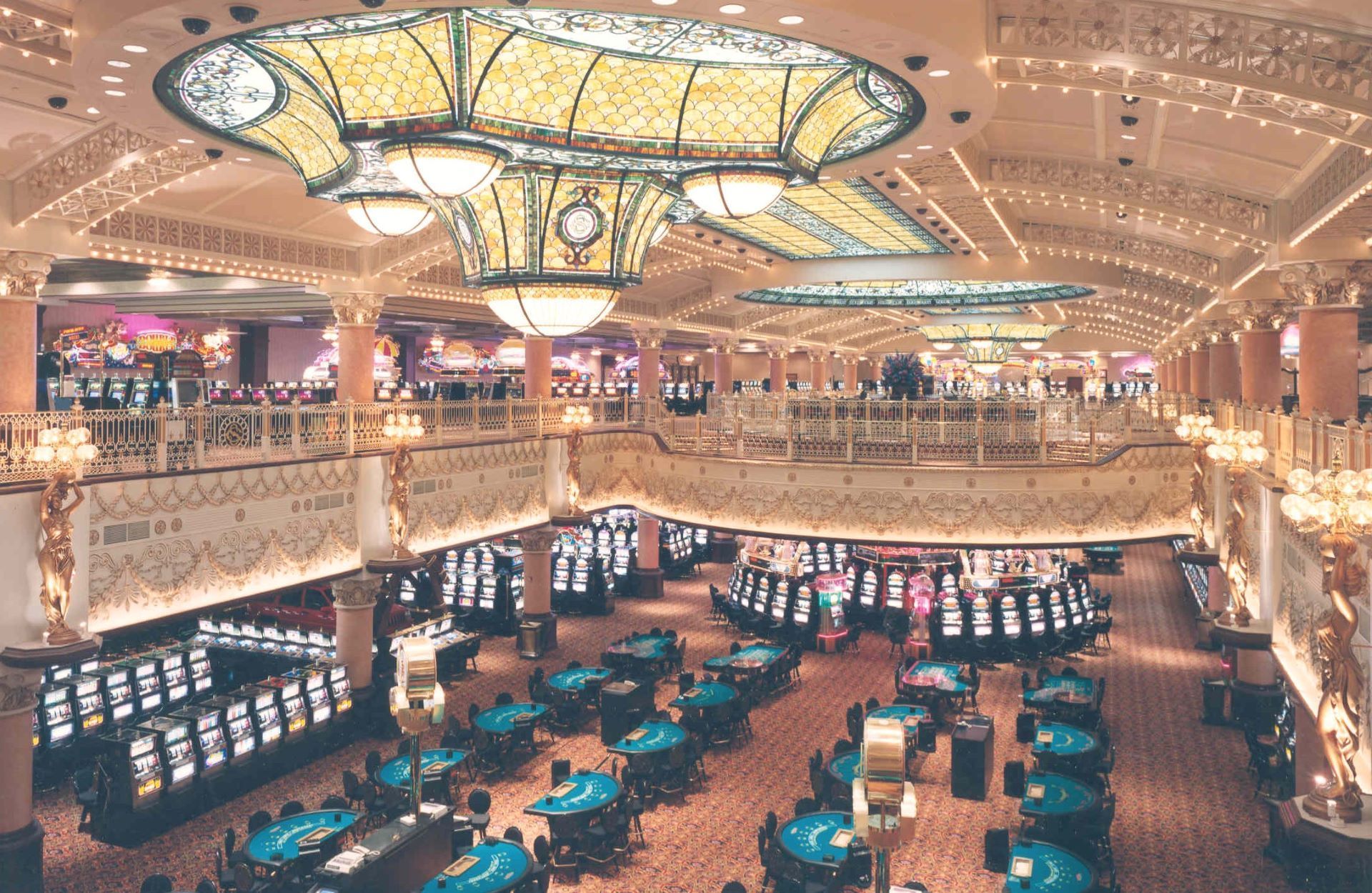 An aerial view of a casino with tables and slot machines.
