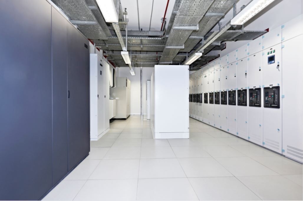 A long hallway in a building with a lot of cabinets