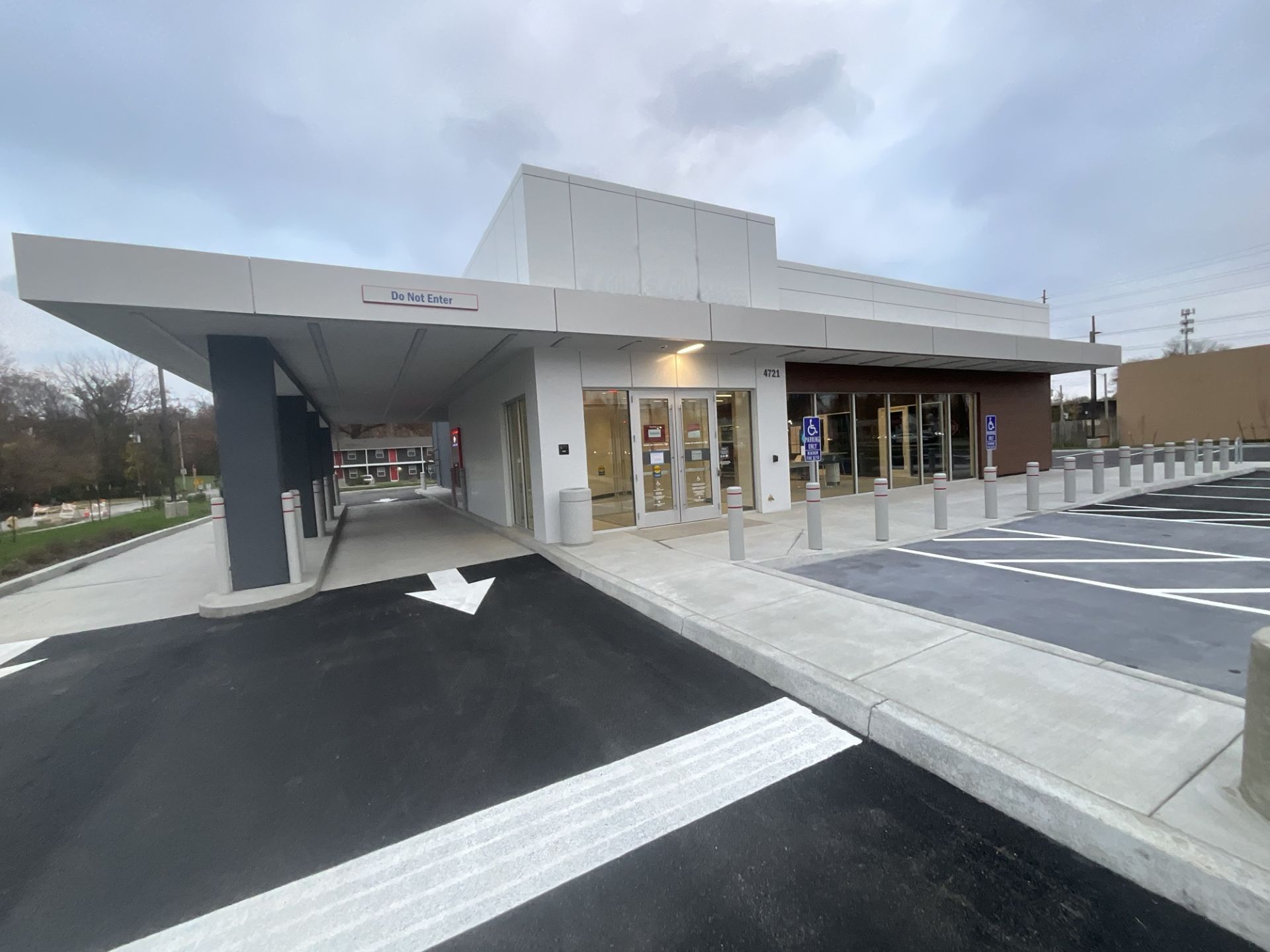 A large building with a parking lot in front of it.