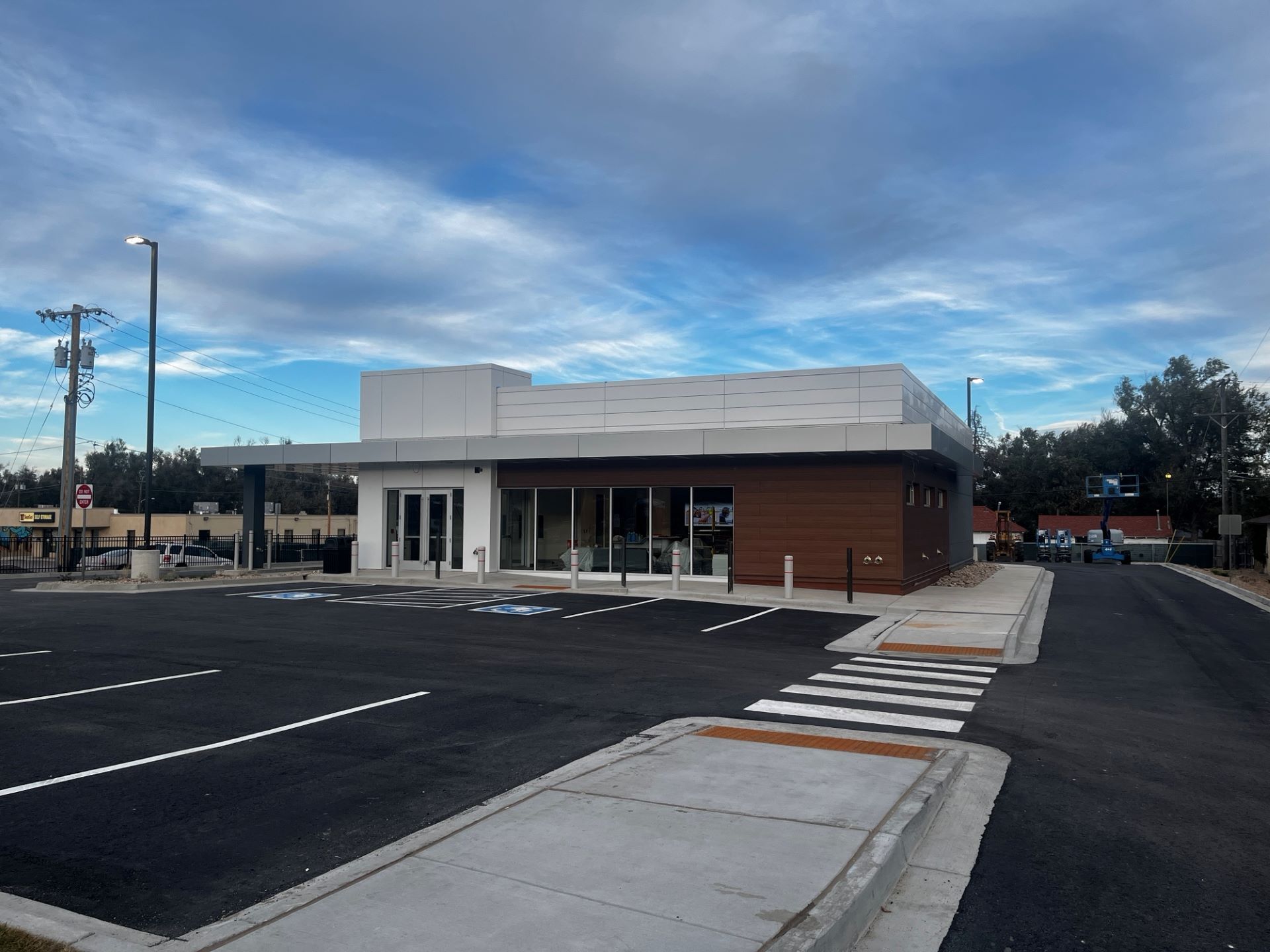 A building with a parking lot in front of it