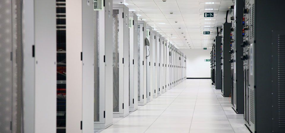 A long hallway filled with rows of servers in a data center.