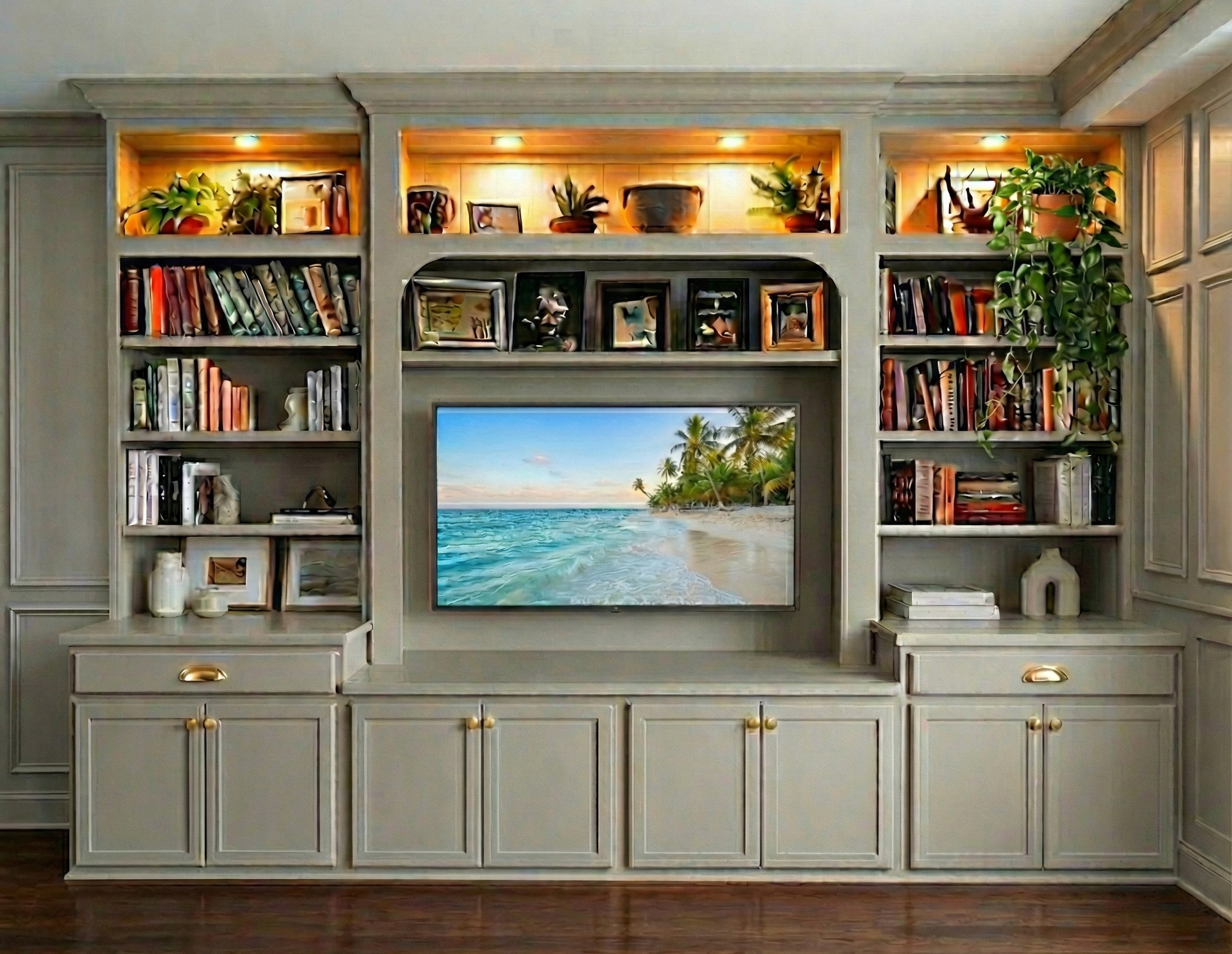 Living room with built-in cabinetry, TV, and light-colored sofa.