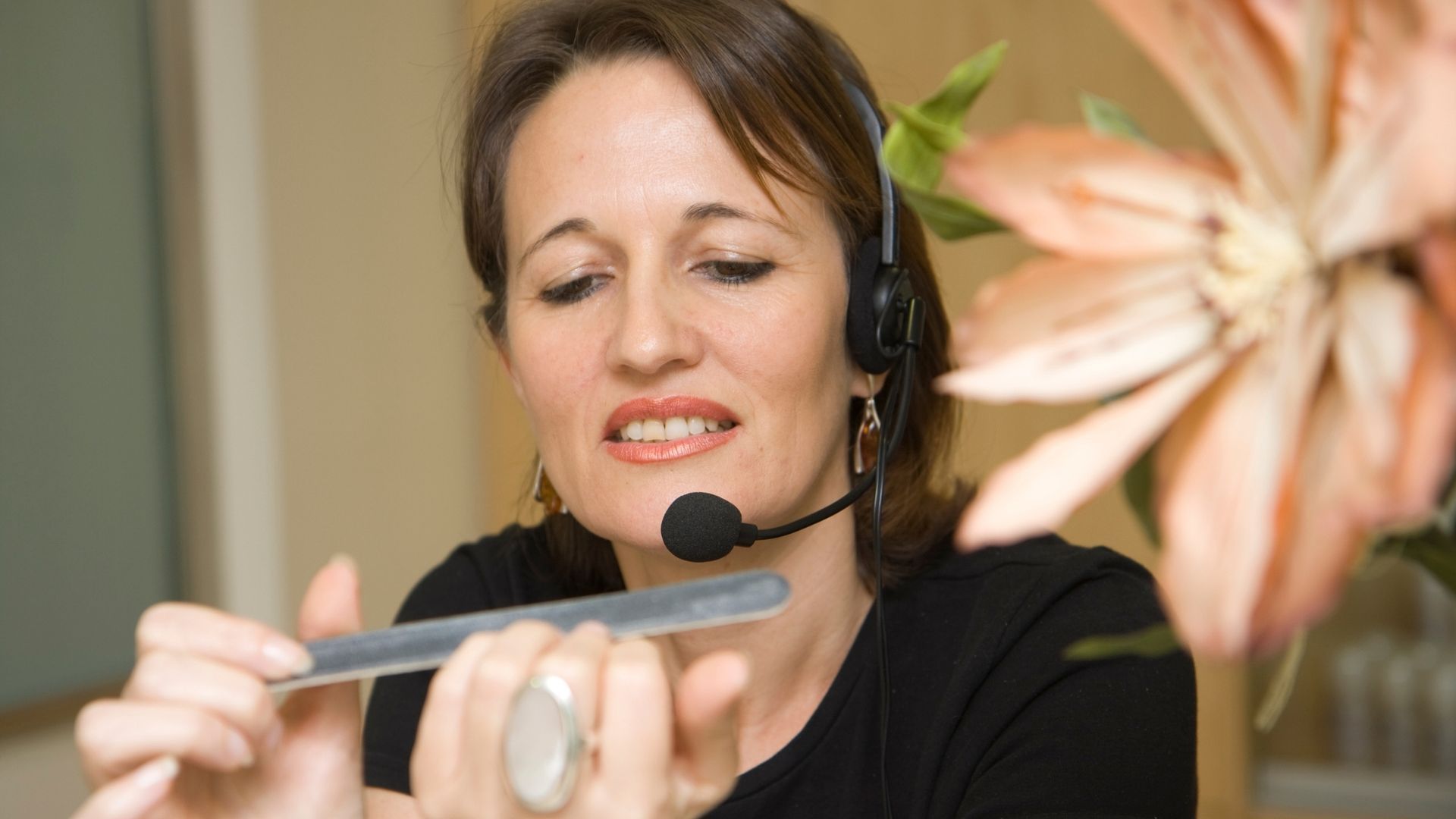 Business owner comparing traditional receptionist costs vs AI call management savings
