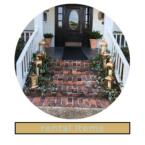 Front porch with brick steps, lanterns, potted plants, and a dark front door; “rental items” label below