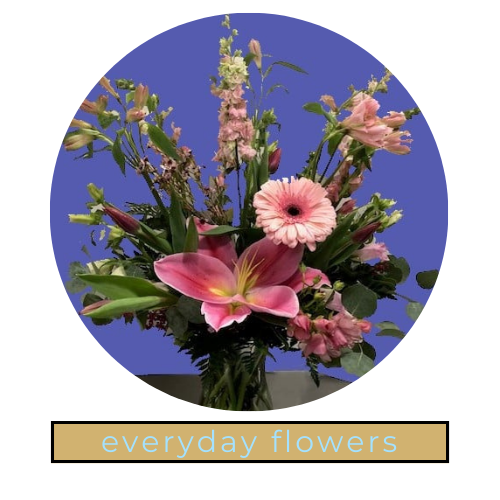 Mixed bouquet of pink and purple flowers in a vase with “everyday flowers” text on a blue background