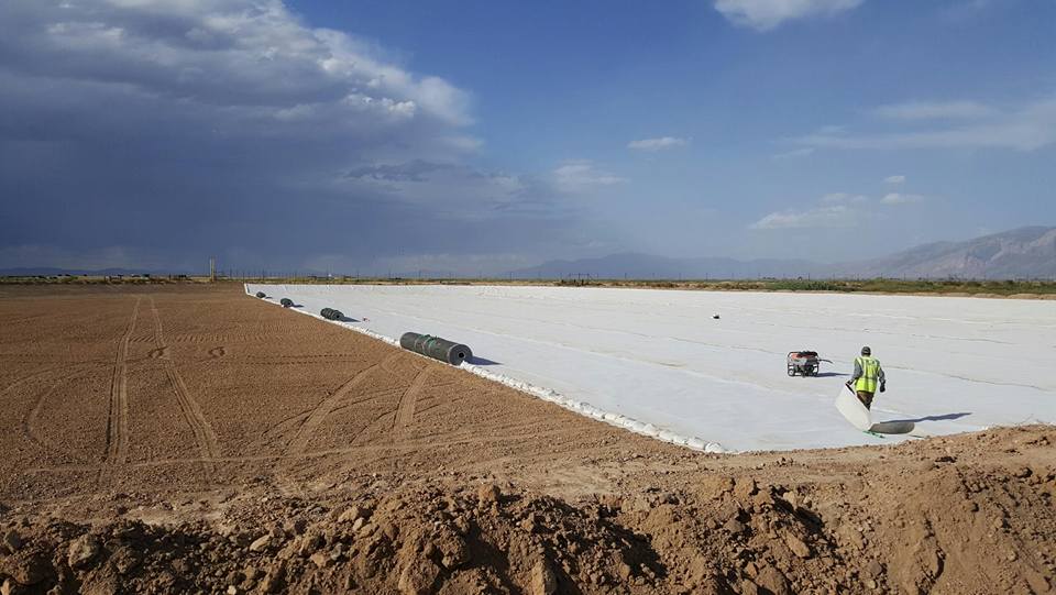 worker in process of prepping for a liner to be installed