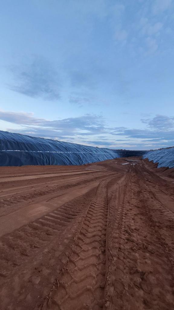 Liners on hillside with dirt road inthe middle
