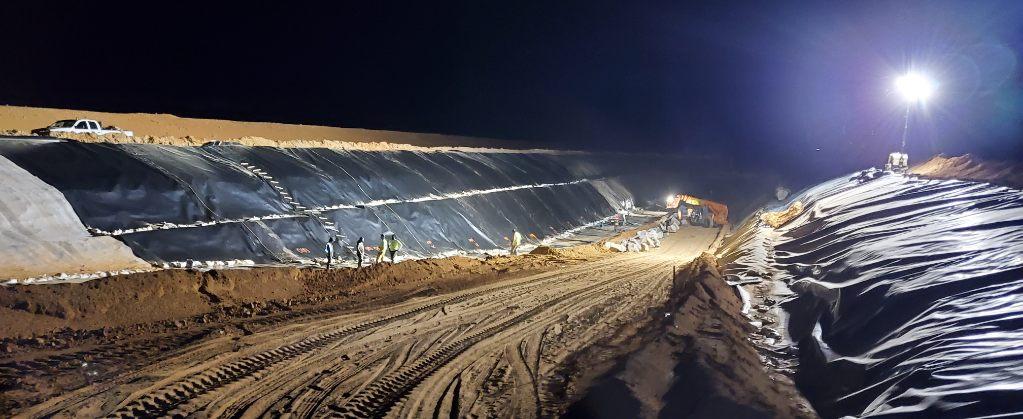 Large liner on hillside of dirt at night time