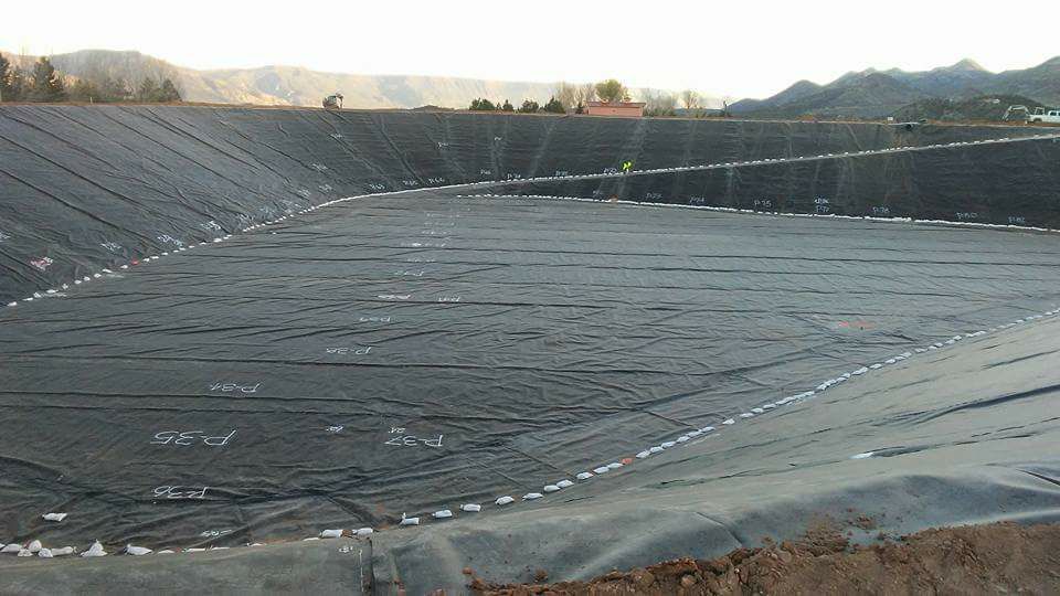 Large liner covering an empty pond