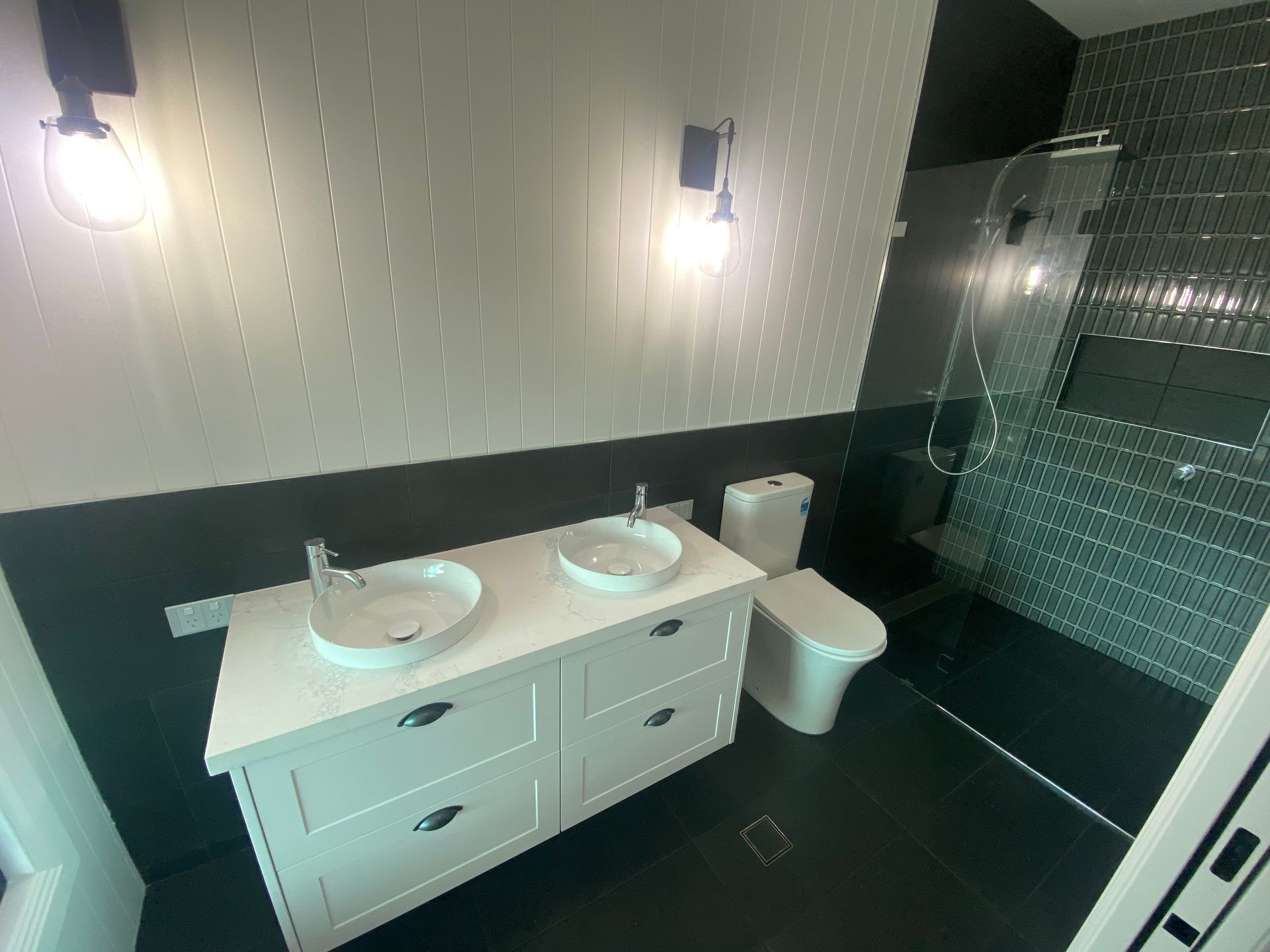 A New Bathroom With A Basin And Two Sinks A Toilet And A Tiled Shower — Lakesway Plumbing and Gas in Forster, NSW