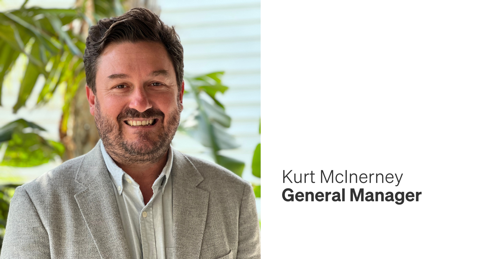 Kurt McInerney, General Manager, smiling, wearing a light-colored suit jacket, with greenery in the background.