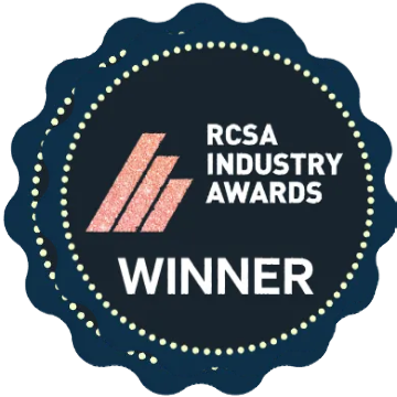 RCSA Industry Awards Winner badge with pink abstract graphic on a navy blue background.