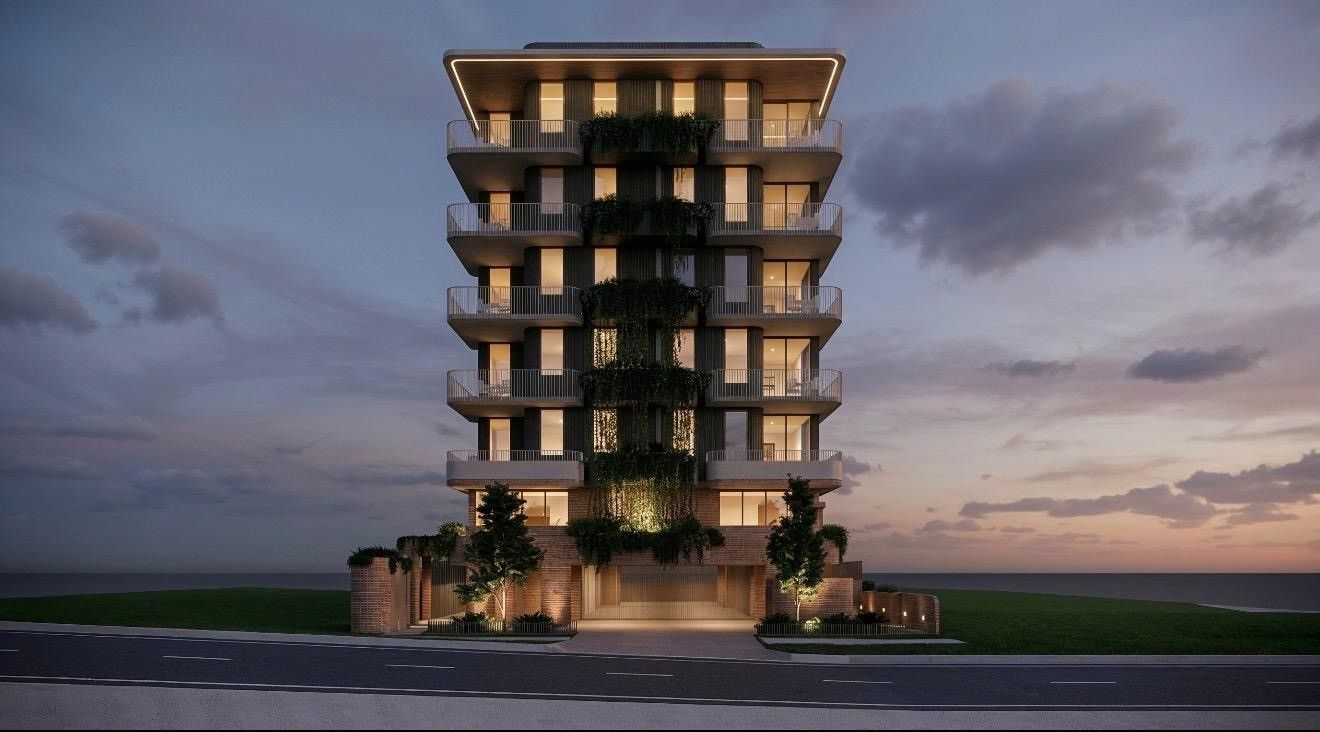 Modern Apartment Tower at Dusk — Construction Services in Southport, QLD