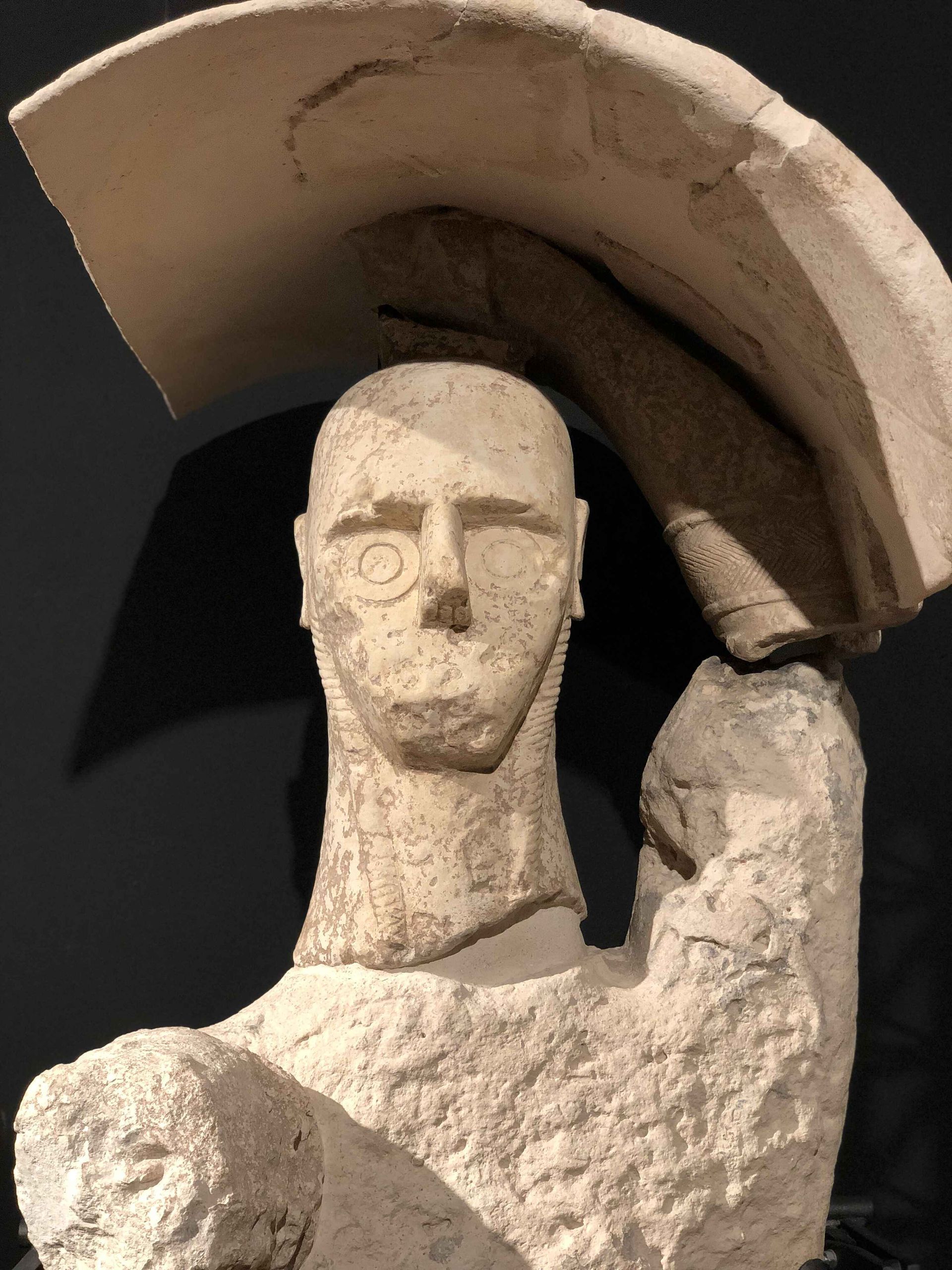a statue of a man with a helmet on his head