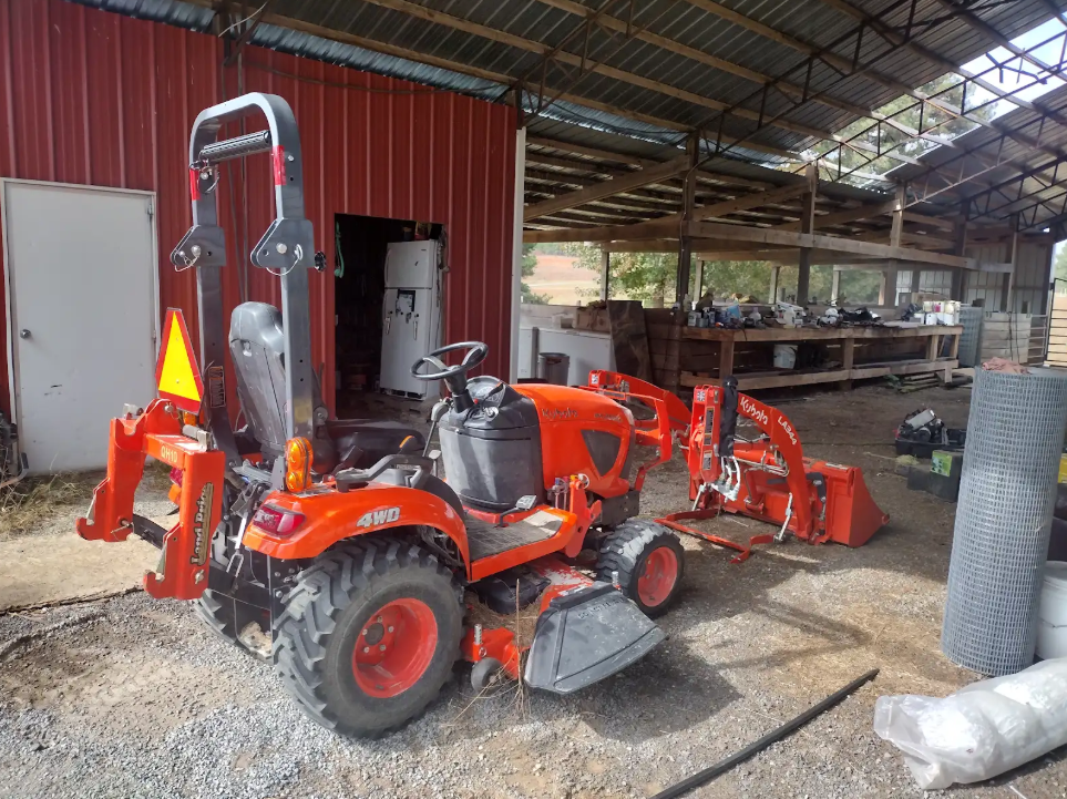 Technician repairing a lawn mower on-site