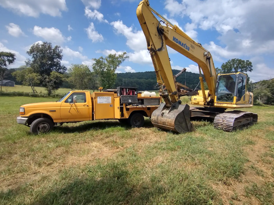 R.K.M Services technician repairing equipment on-site