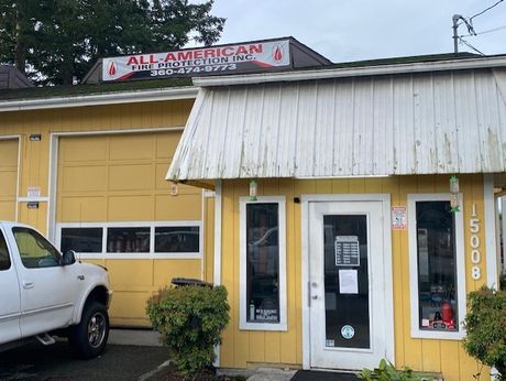 Workers Using Fire Extinguisher — Marysville, WA — All American Fire Protect