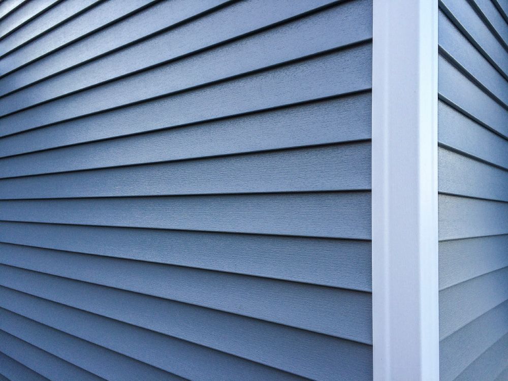 Blue Vinyl Siding — San Antonio, TX — Roof Chiefs Inc Blue Vinyl Siding — San Antonio, TX — Roof Chiefs Inc