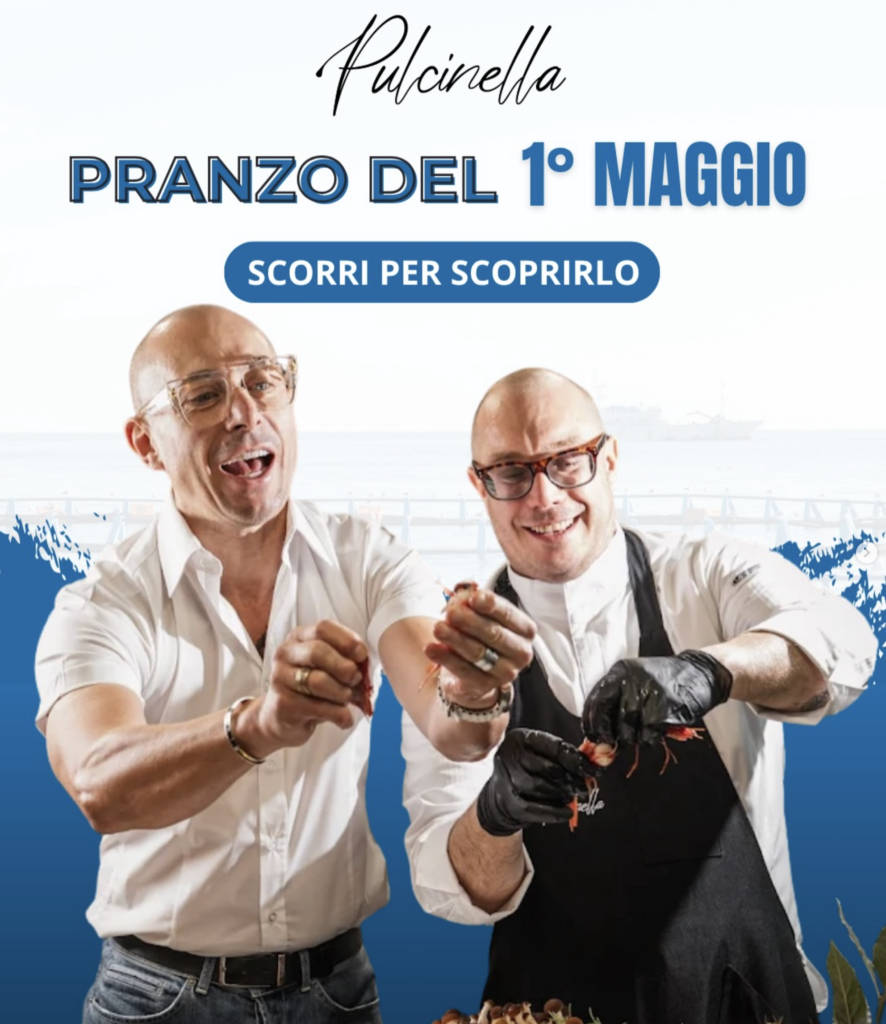 Locandina di Pranzò del 1° maggio con due chef sorridenti e un piatto di granchio nero.