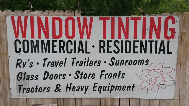 Sign advertising window tinting services for commercial and residential clients.