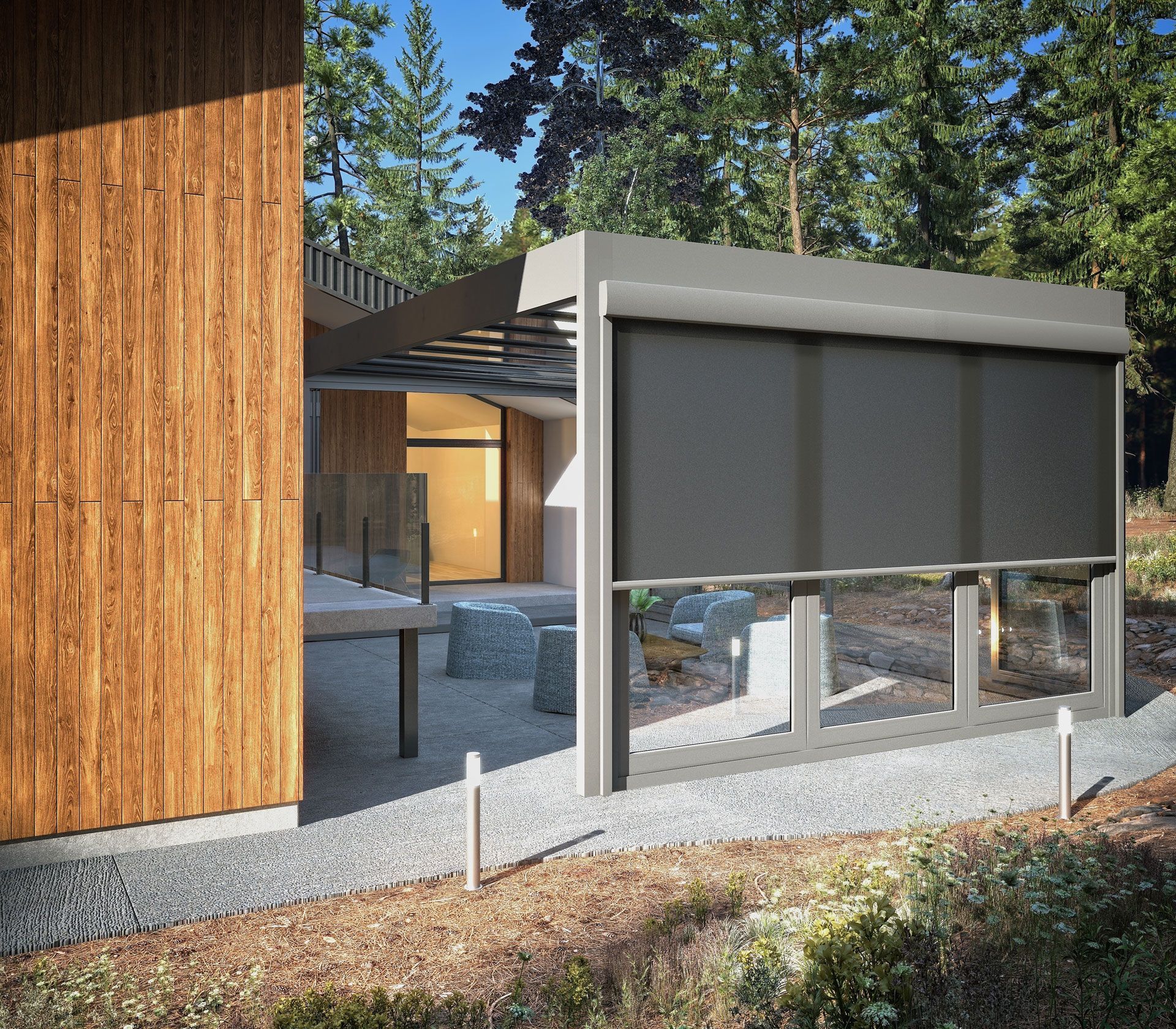 A modern patio with a retractable dark screen, wooden siding, and a gravel path surrounded by trees.