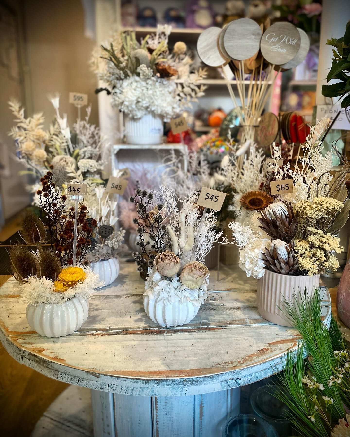 Dried Flower Arrangements on a Rustic Table — Ivy Lane Flowers & Gifts in Birtinya, QLD