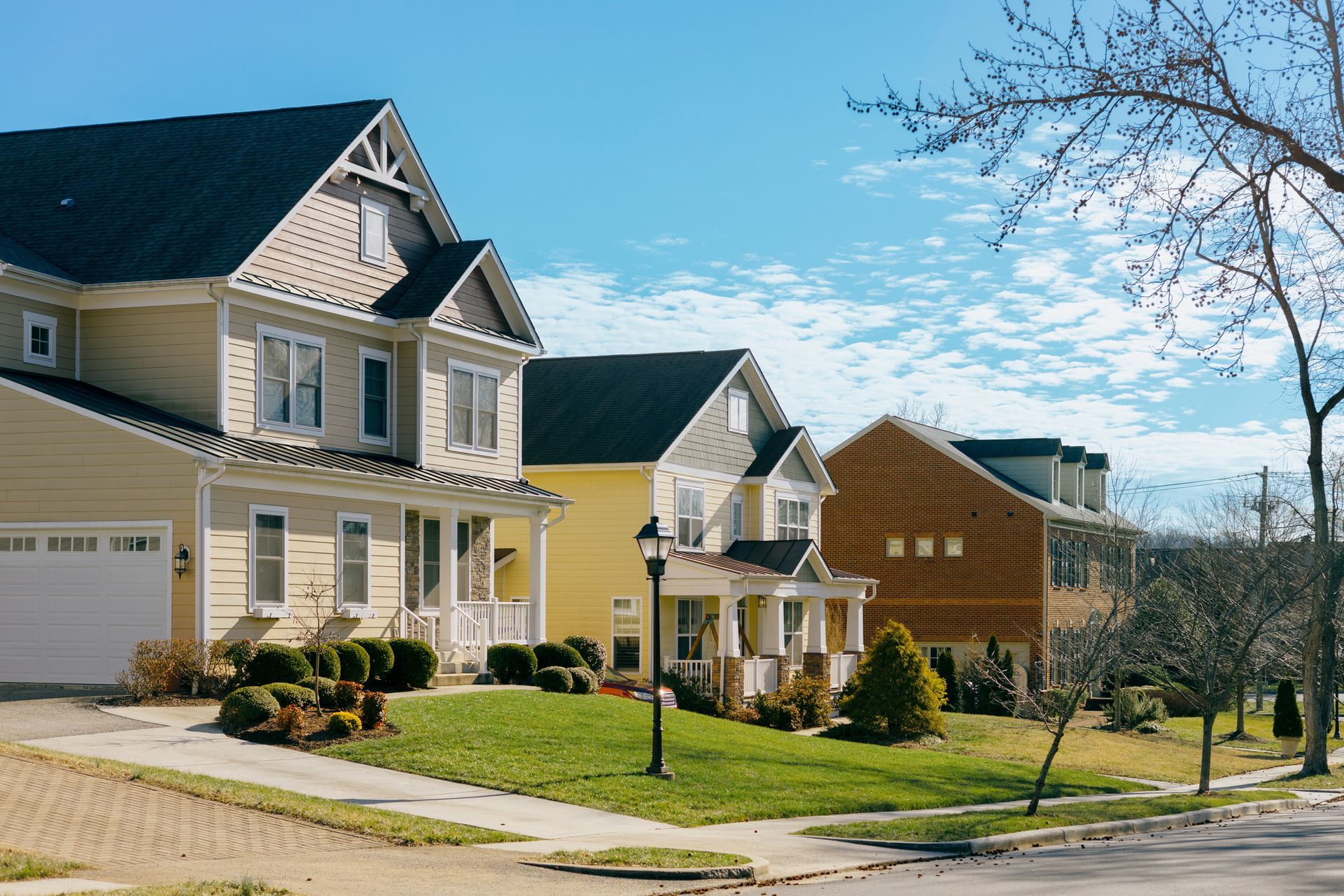 A Row of Houses in A Residential Neighborhood on A Sunny Day – Dayton, OH – Home Services Title