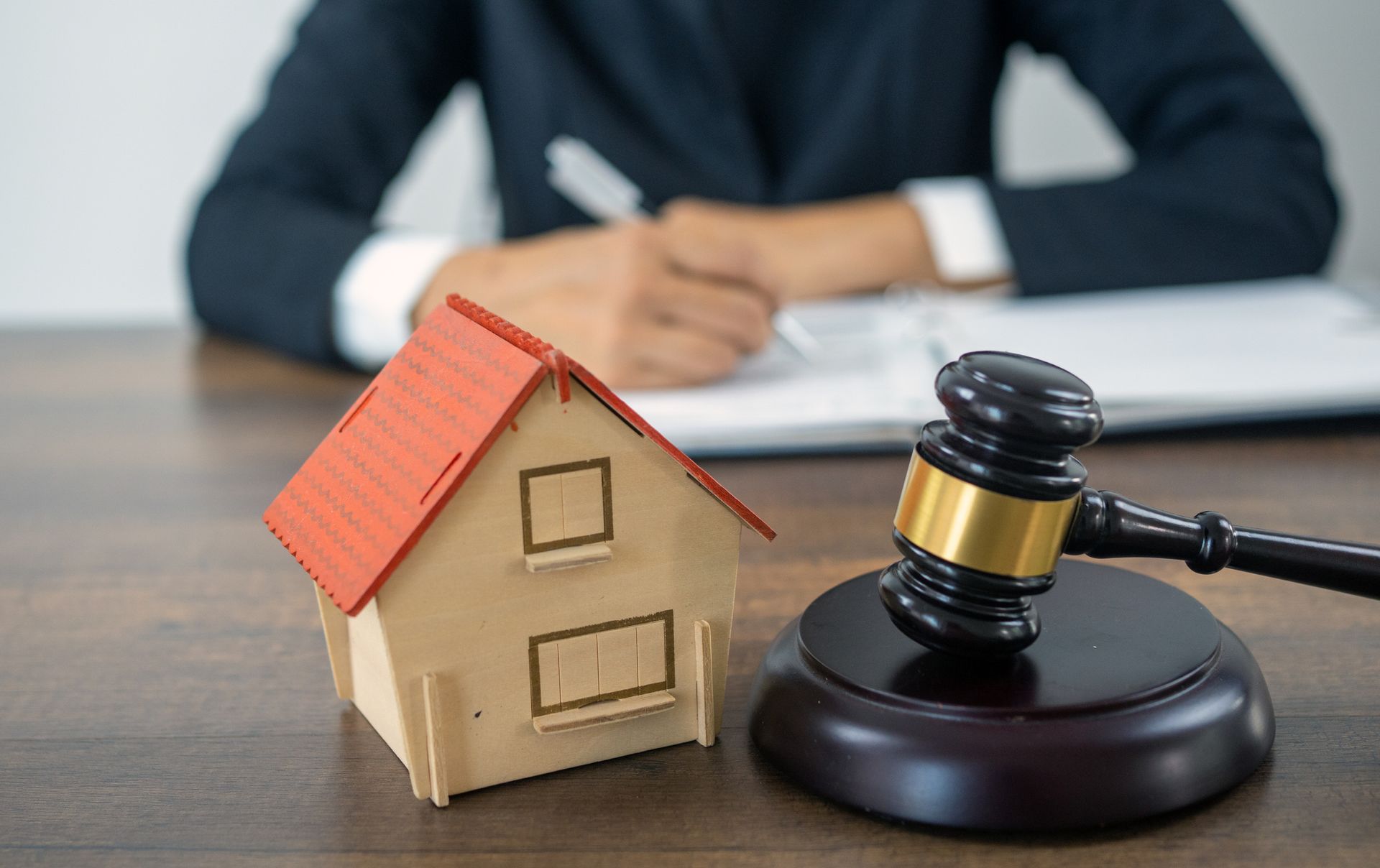 A Wooden House Is Sitting on A Wooden Table – Dayton, OH – Home Services Title