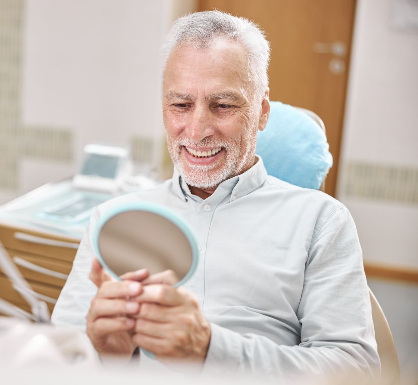 Best restorative dentist for adults and children near Somerset, NJ. Old man smiling after restorative dental care | Natural dentist for crowns and bridges